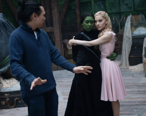 Jon M. Chu, Cynthia Erivo and Ariana Grande on the set of Wicked. Photo: Giles Keyte/Universal Pictures